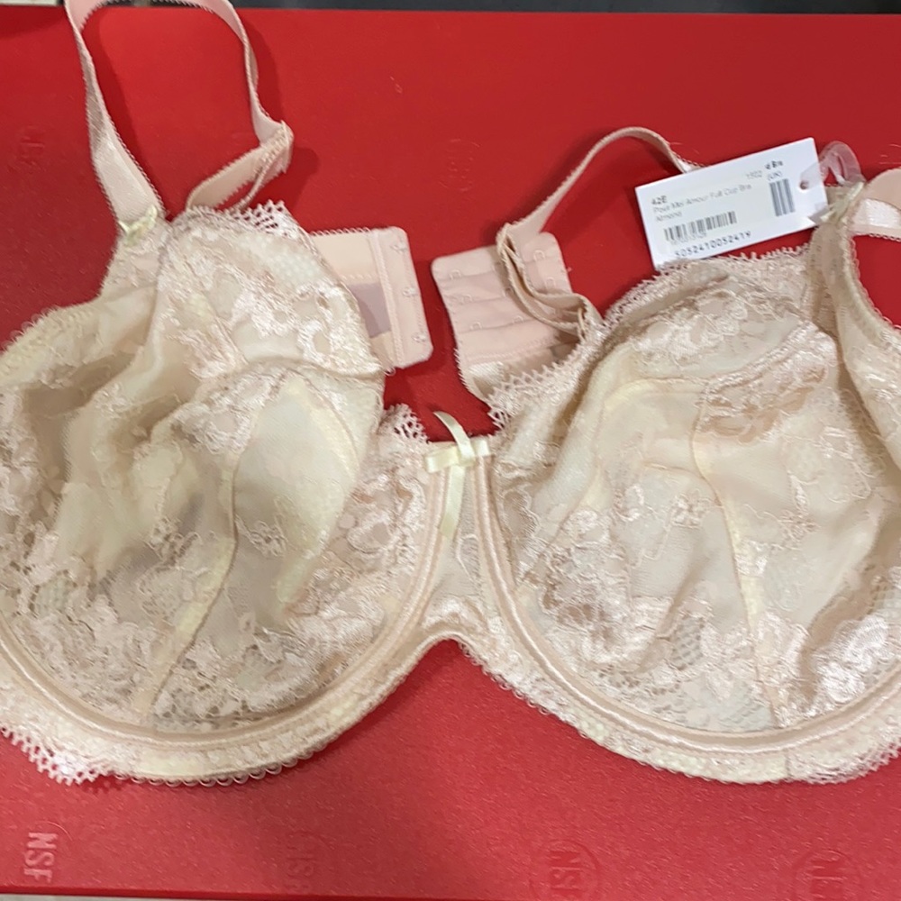 Brand new w/tag a beige color, lightly lined, full cup bra size 42E